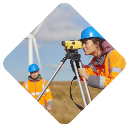 Man and women in a high vis working on a wind farm